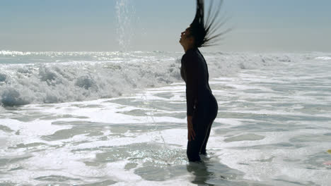 Female-surfer-flipping-her-wet-hair-in-the-sea-4k
