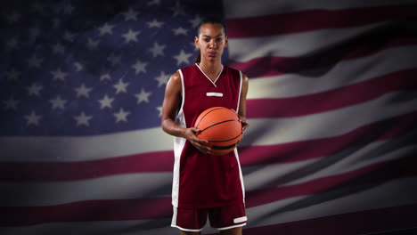 Female-basketball-player-against-waving-US-flag