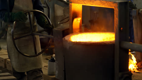 Workers-melting-metal-in-foundry-workshop-4k
