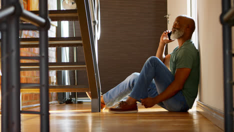 Senior-man-talking-on-mobile-phone-at-home-4k