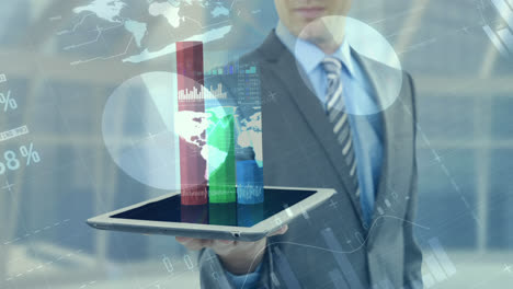 Business-man-using-numeric-tablet-against-finacial-data-4k