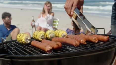 Man-cooking-food-on-barbecue-at-beach-4k