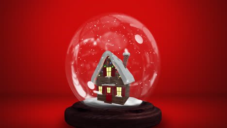 Animation-of-snow-globe-with-snow-falling-and-house-on-red-background