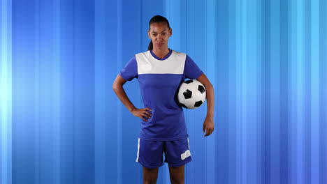 Female-soccer-player-against-abstract-blue-background