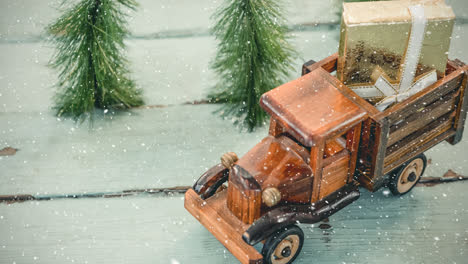 Model-car-with-a-present-on-its-roof-combined-with-falling-snow