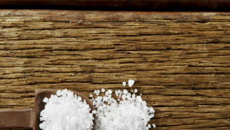 Salt-in-spoon-on-wooden-table-4k