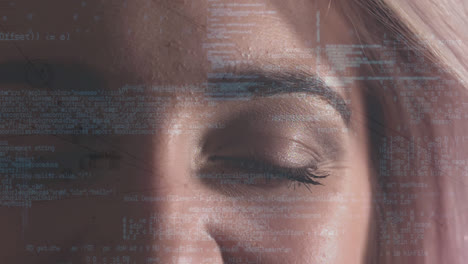 Digital-composite-of-a-woman-eye-looking-at-the-coding-system
