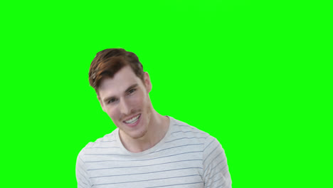 Caucasian-man-smiling-at-camera-on-green-background