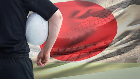 Rugby-player-holding-ball-against-Japanese-flag