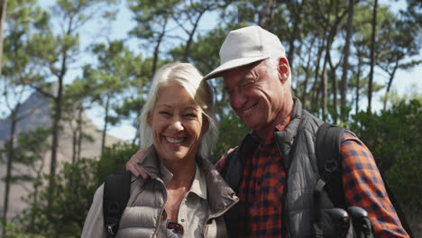 Front-view-of-active-senior-couple-in-forest