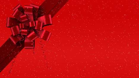Animation-of-snow-falling-against-christmas-present-ribbon-on-red