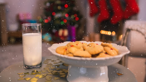Falling-snow-with-Christmas-treat-for-Santa-with-cookies-and-milk