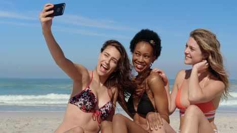 Young-female-friends-taking-selfie-with-phone-4k
