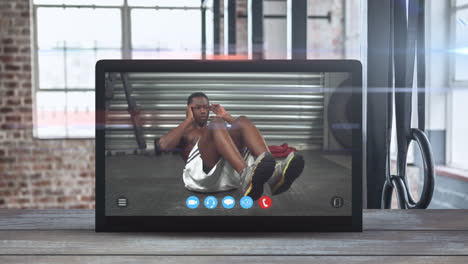 Animation-of-tablet-computer-showing-a-African-American-man-exercising.-Coronavirus--spreading