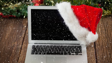 Falling-snow-with-Christmas-laptop