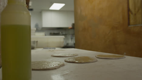 African-American-man-making-pizza-dough
