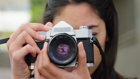Woman-clicking-photo-with-digital-camera-4k