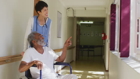Nurse-helping-a-senior-man-in-retirement-house