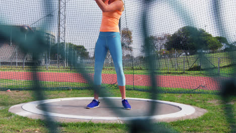Low-section-of-female-athlete-practicing-hammer-throw-at-sports-venue-4k