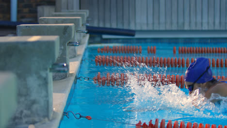 Female-swimmer-cheer-at-finishing-line-of-swimming-pool-4k
