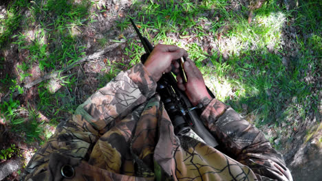 Hunter-loading-bullet-into-shotgun-4k
