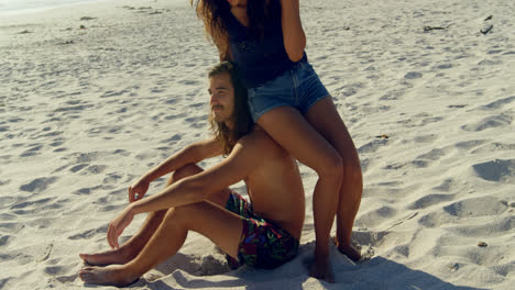 Couple-having-fun-on-the-beach-4k
