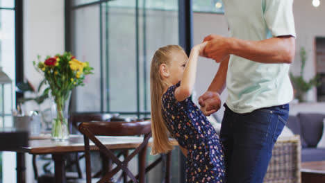 Father-and-daughter-dancing-together