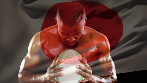 Shirtless-male-rugby-player-holding-ball-and-screaming