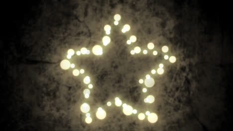 Glowing-star-of-fairy-lights-on-grey-background