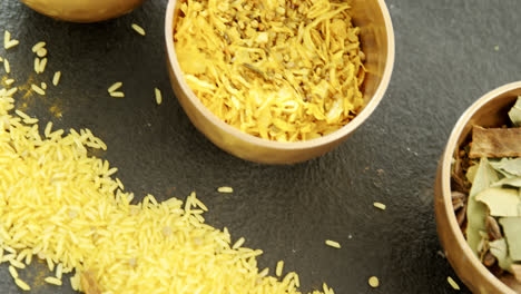 Various-spices-in-bowl-with-yellow-rice-4k