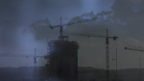 Cranes-on-top-of-a-building-and-lightning
