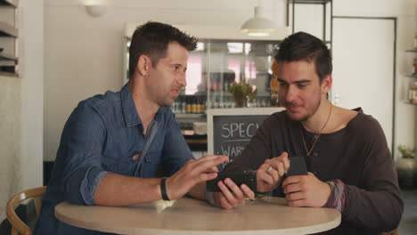Caucasian-men-spending-time-together-in-a-coffee-