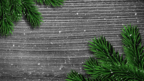 Video-composition-with-snow-over-pine-frame-on-wood