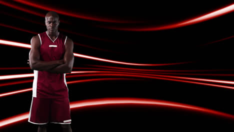 Male-basketball-player-against-red-light-trails