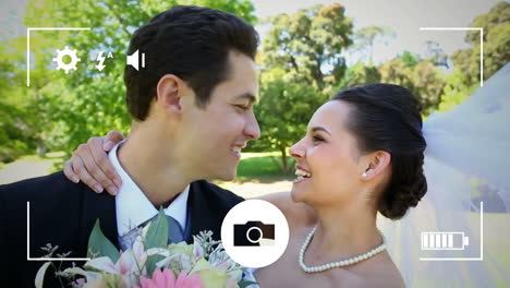 Taking-photos-of-a-bride-and-groom-on-a-digital-camera