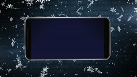 Animation-of-blank-smartphone-screen-with-snow-falling-in-the-background