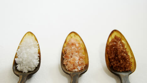 Various-types-of-sea-salt-in-a-spoon-4k