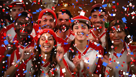 Group-of-fans-cheering-for-their-team-with-confetti