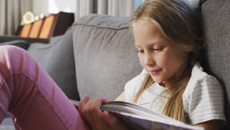 Little-Caucasian-girl-reading-a-book