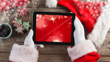 Der-Weihnachtsmann-Benutzt-Ein-Tablet-Mit-Weihnachtsschneeflocken