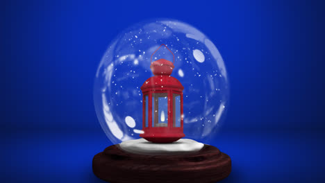 Digital-animation-of-snow-falling-over-christmas-lantern-in-a-snow-globe-against-blue-background