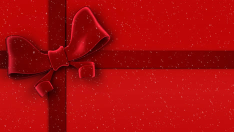 Animation-of-snow-falling-against-christmas-present-ribbon-on-red