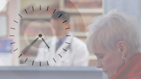 Digital-clock-ticking-against-woman-sitting-in-hospital