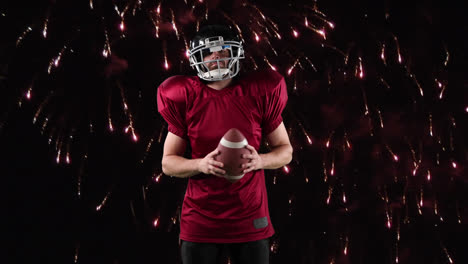 Male-rugby-player-against-fireworks-in-background