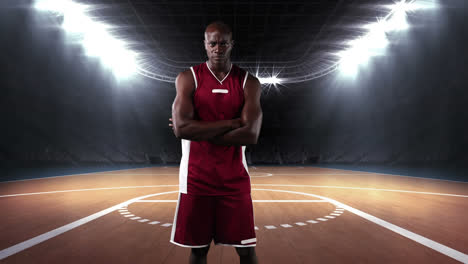 Male-basketball-player-against-sports-stadium-in-background-