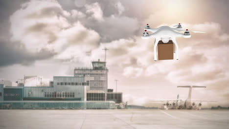 Drone-Llevando-Una-Caja-En-Un-Aeropuerto
