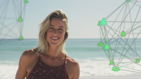 Animation-of-spinning-networks-with-social-media-digital-icons-over-smiling-woman-on-beach