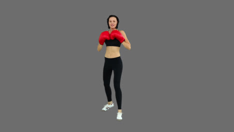 Fit-brunette-boxing-with-red-gloves