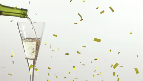 Animation-of-confetti-falling-over-champagne-glass-on-white-background