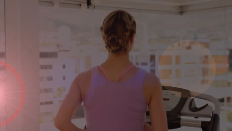Animation-of-glowing-light-over-woman-running-on-treadmill